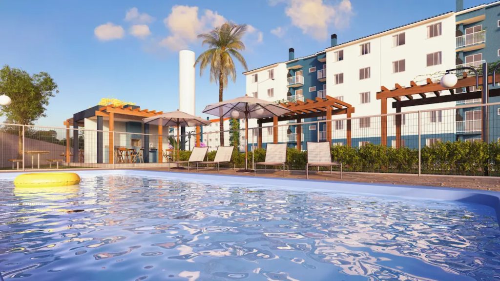 O ChatGPT disse: Piscina em área comum de condomínio com espreguiçadeiras, pergolados e prédio residencial ao fundo.